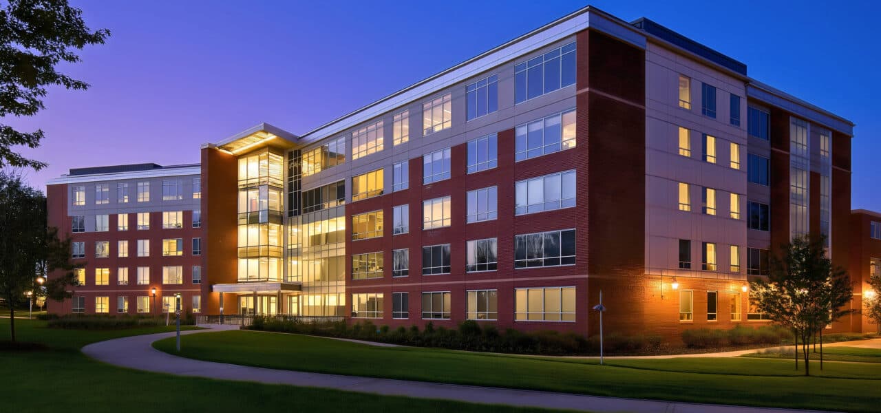Multi story school dorm building exterior, modern university cam