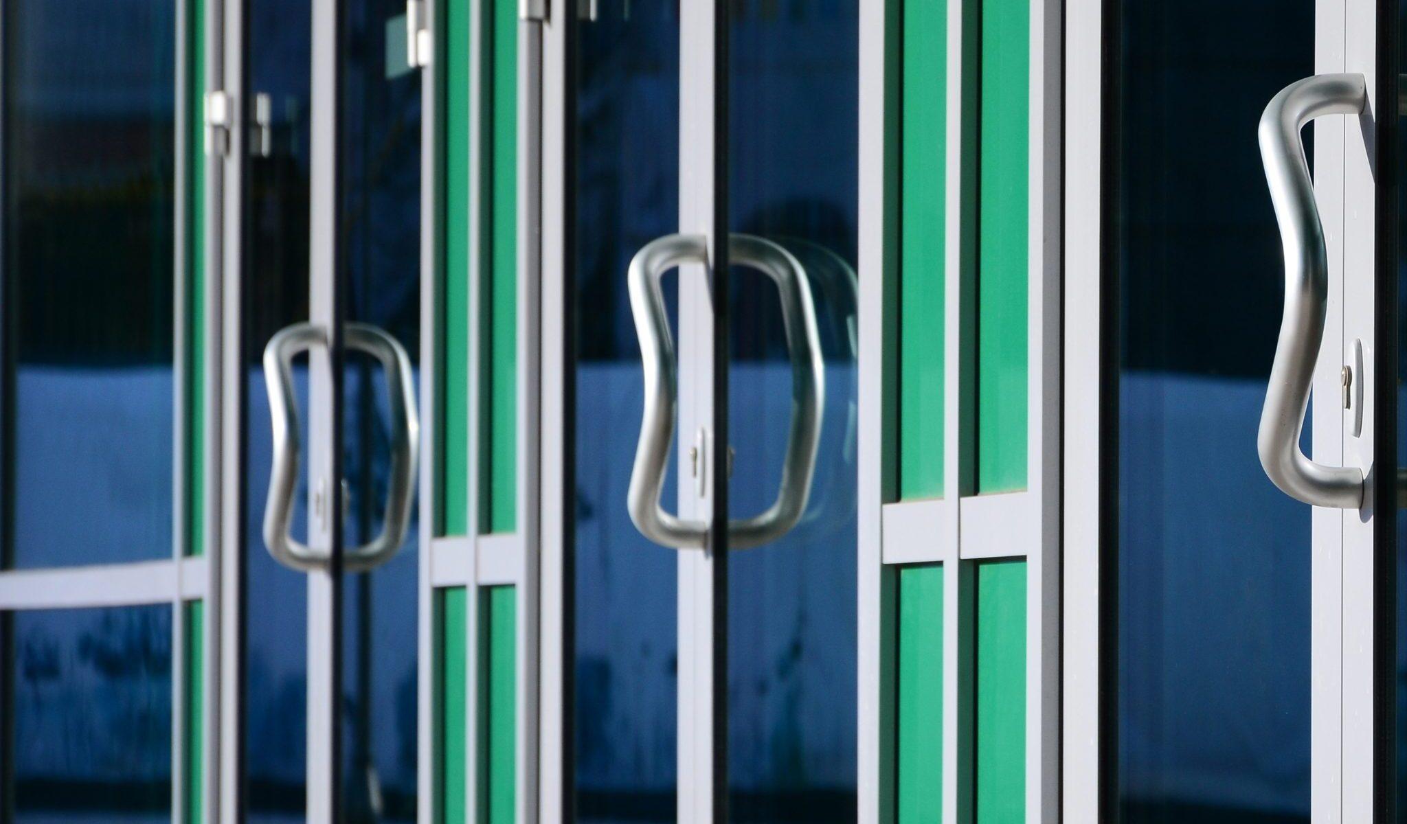 chrome-door-handle-and-glass-of-modern-aluminium-d-2026-03-24-05-28-18-utc-2048x2048